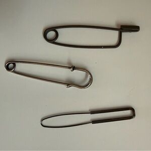 Sweater pins. Three.
